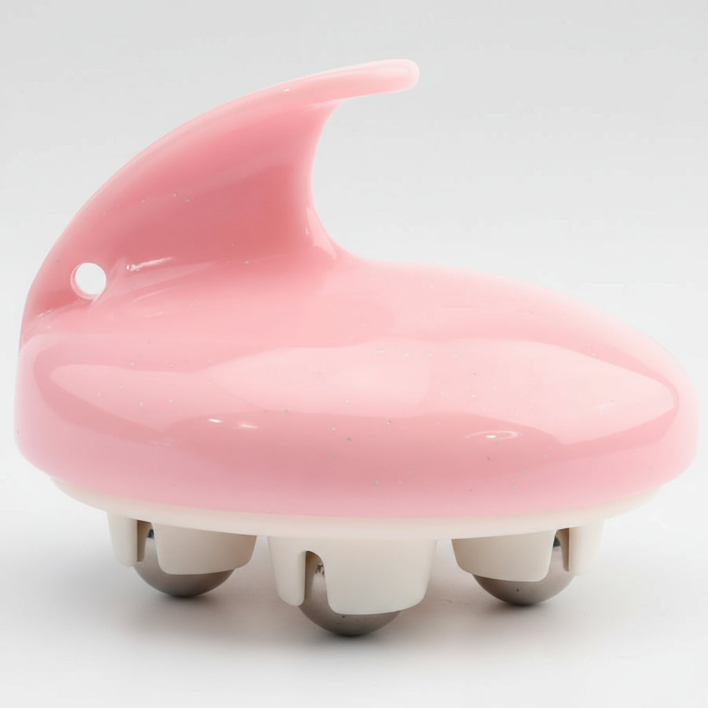 Pink scalp massager on a white background