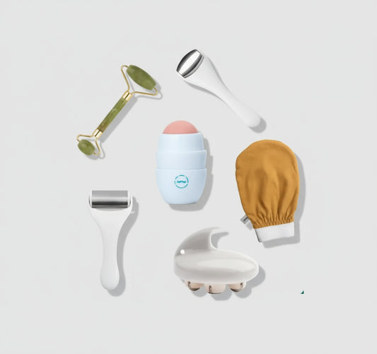 Set of skincare tools including a roller, peeling device, and gloves on a white background with green leaf patterns.
