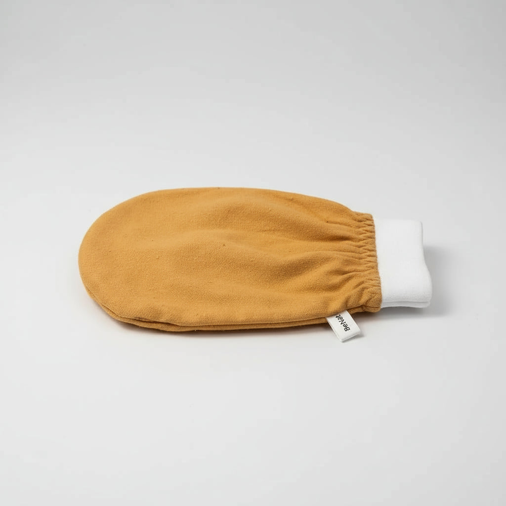 Yellow baby mitt with white cuff on a white background