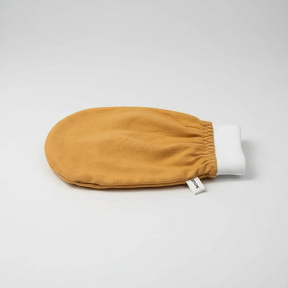 Yellow baby mitt with white cuff on a white background